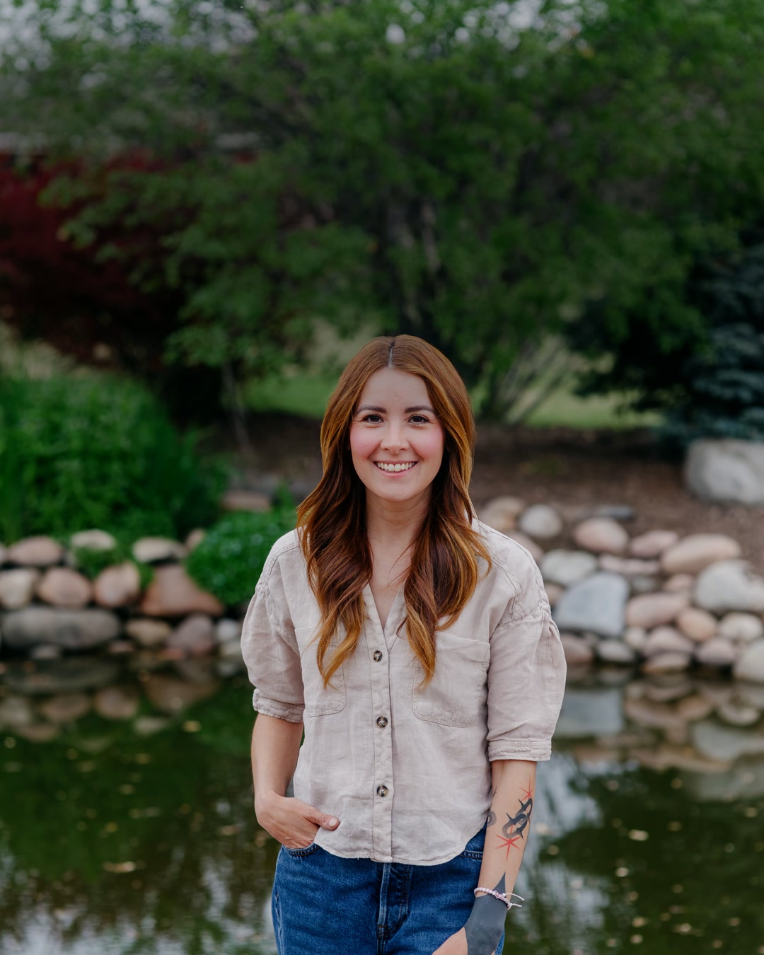 Wendy standing by the pond